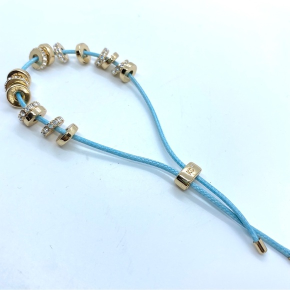 KENNETH COLE Slider Bracelet Goldtone and Blue Cording - Picture 5 of 5